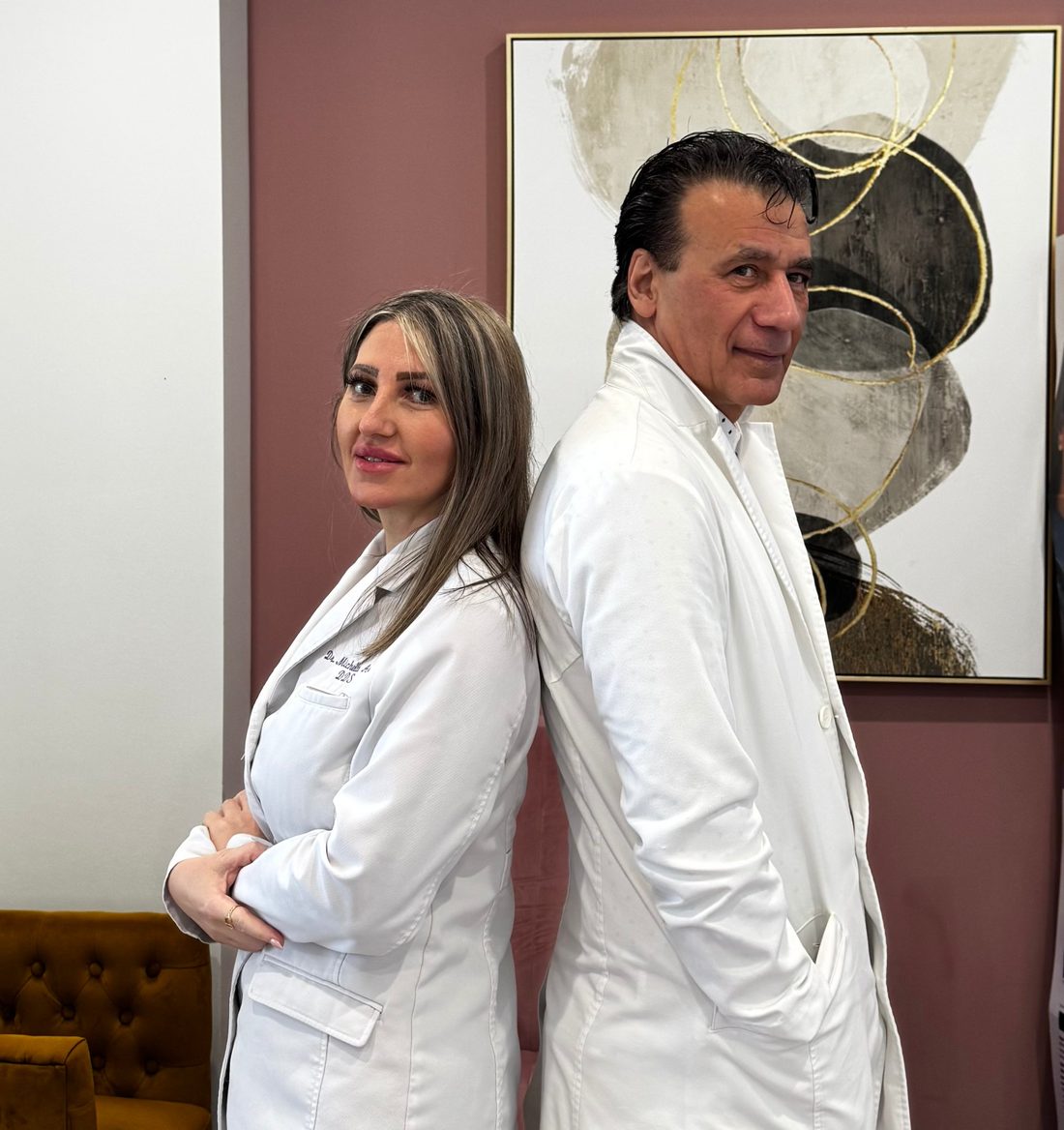 Dr. Michelle Arria and Dr. Adam Arria in white coats at the practice
